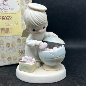 Precious Moments "What The World Needs Is Love" figurine